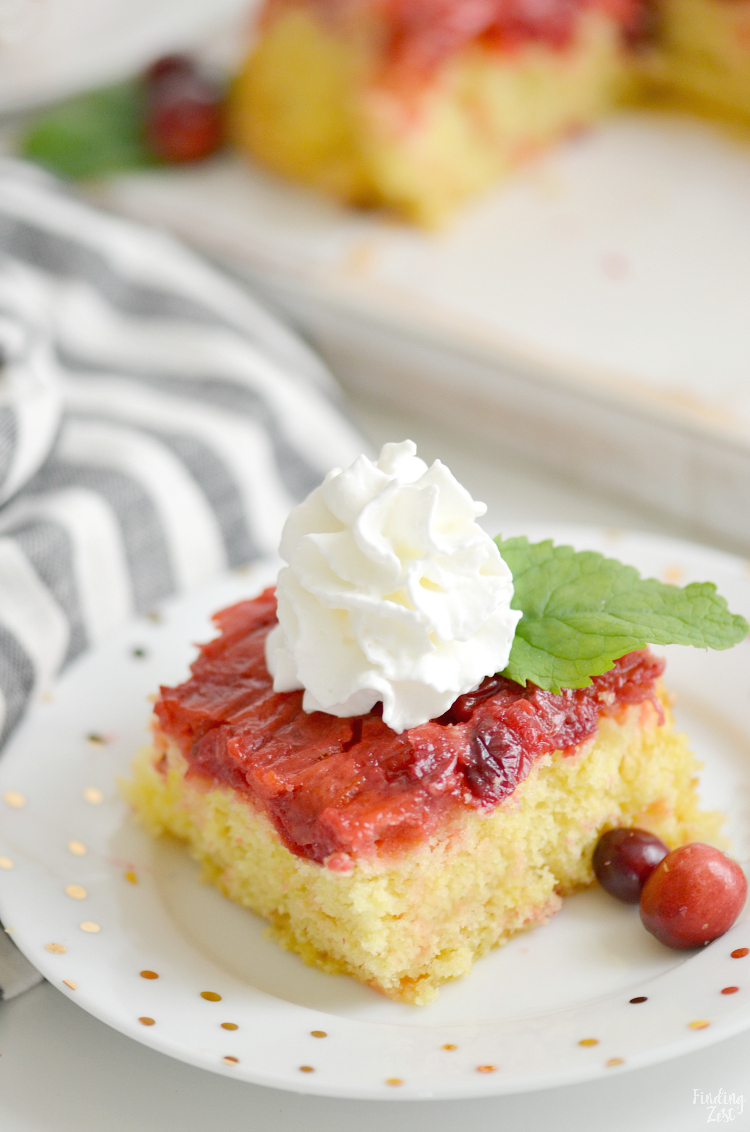 This easy Cranberry Upside Down Cake is the perfect blend of sweet and tart and features a soft and fluffy cake with pudding added. Guests won't be able to resist this cranberry cake that uses fresh cranberries and orange zest. Forget frosting and serve for Thanksgiving or Christmas dessert with whipped cream!