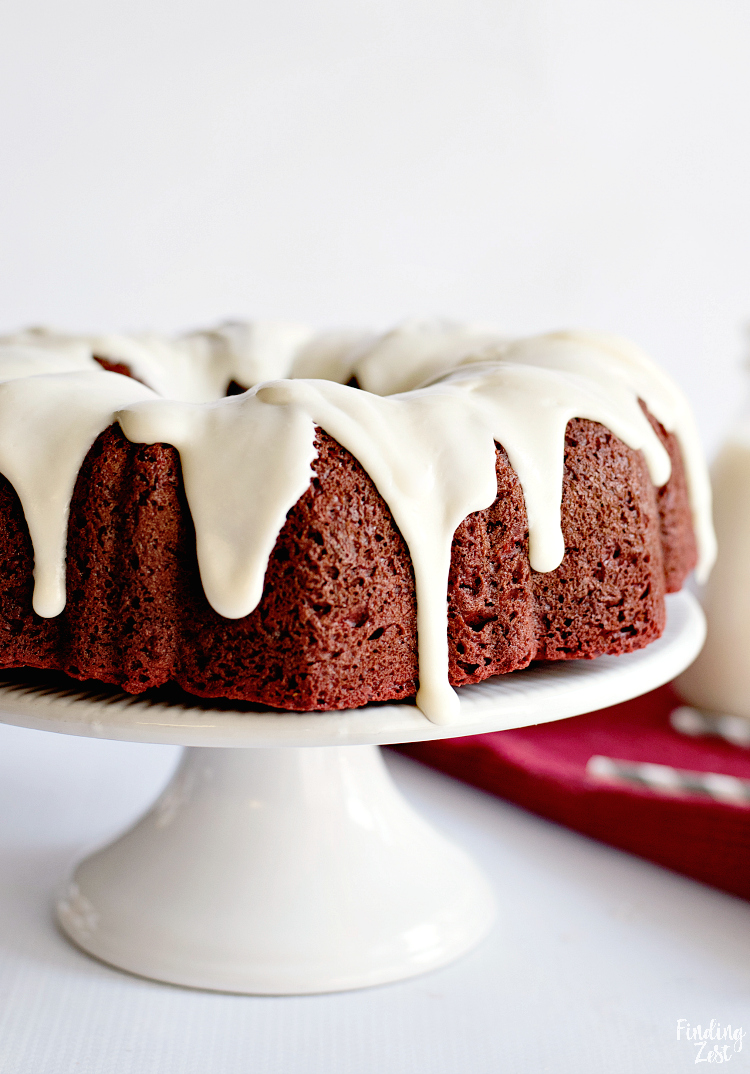 Your family won't be able to resist this red velvet bundt cake with cream cheese filling. Wow guests with this beautiful red and white cake that is easy to make and absolutely delicious. Make it for Christmas dessert or a special Valentine's Day sweet treat!