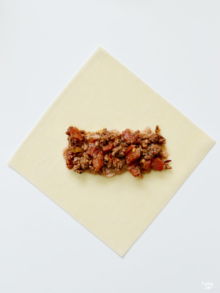 making a mexican egg roll with hamburger