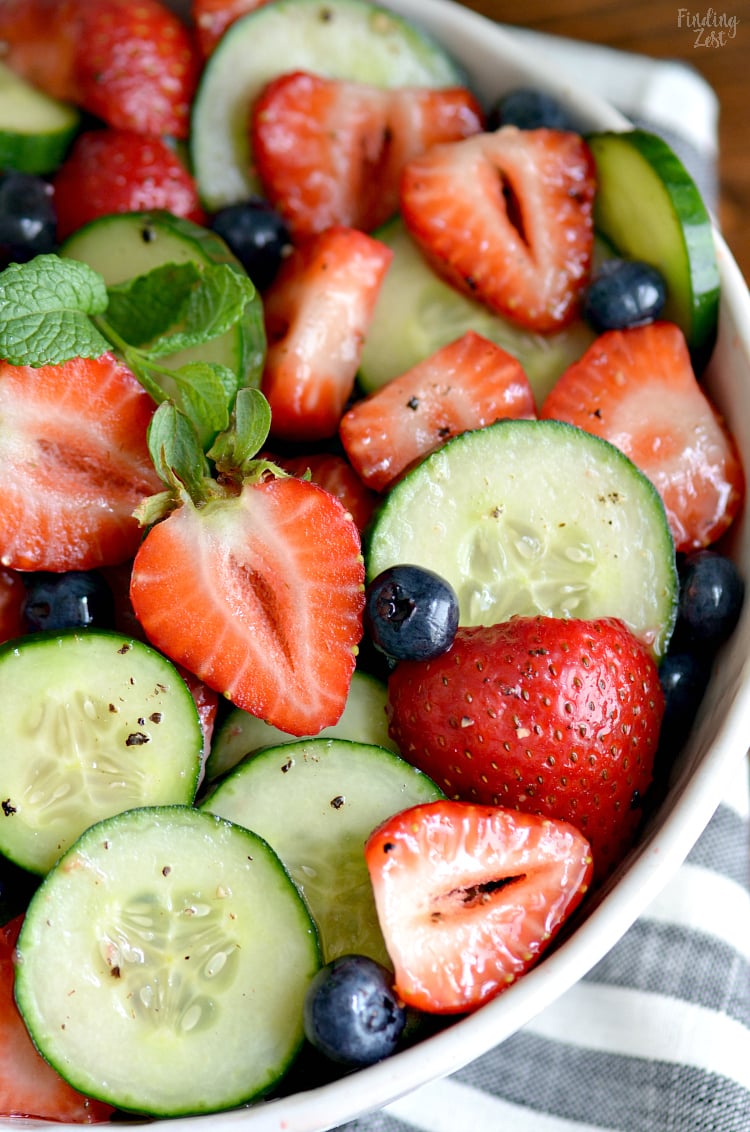 This Strawberry Cucumber Salad is your answer for what to serve with dinner tonight or at your next cookout. Loaded with fresh strawberries, cucumbers and blueberries, this refreshing summer side salad is so easy yet full of flavor!