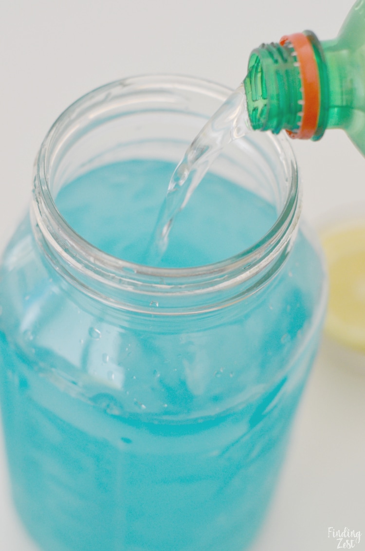 Pouring soda into lemonade punch