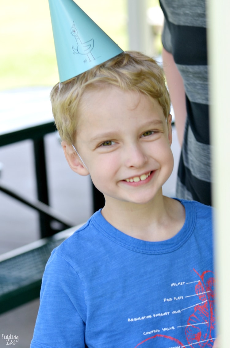 Kid enjoying Mo Willems Pigeon Summer Party