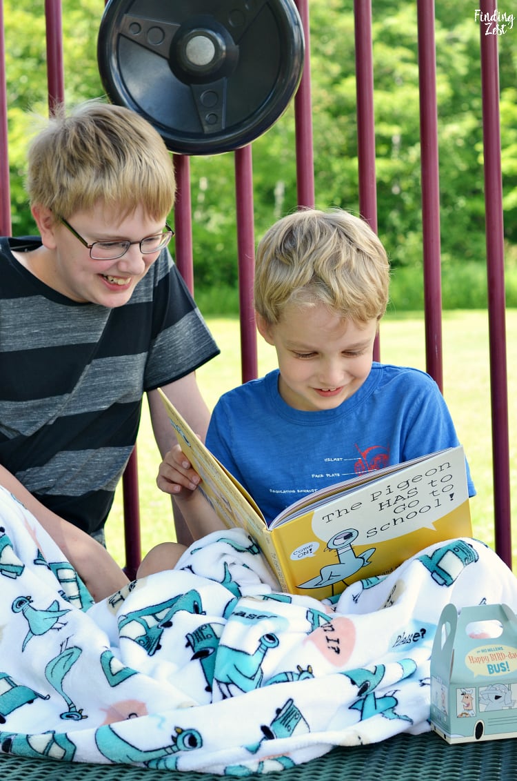 Kids reading The Pigeon Has to Go to School by Mo Willems