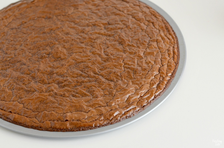 Brownie cooked in a round pizza pan