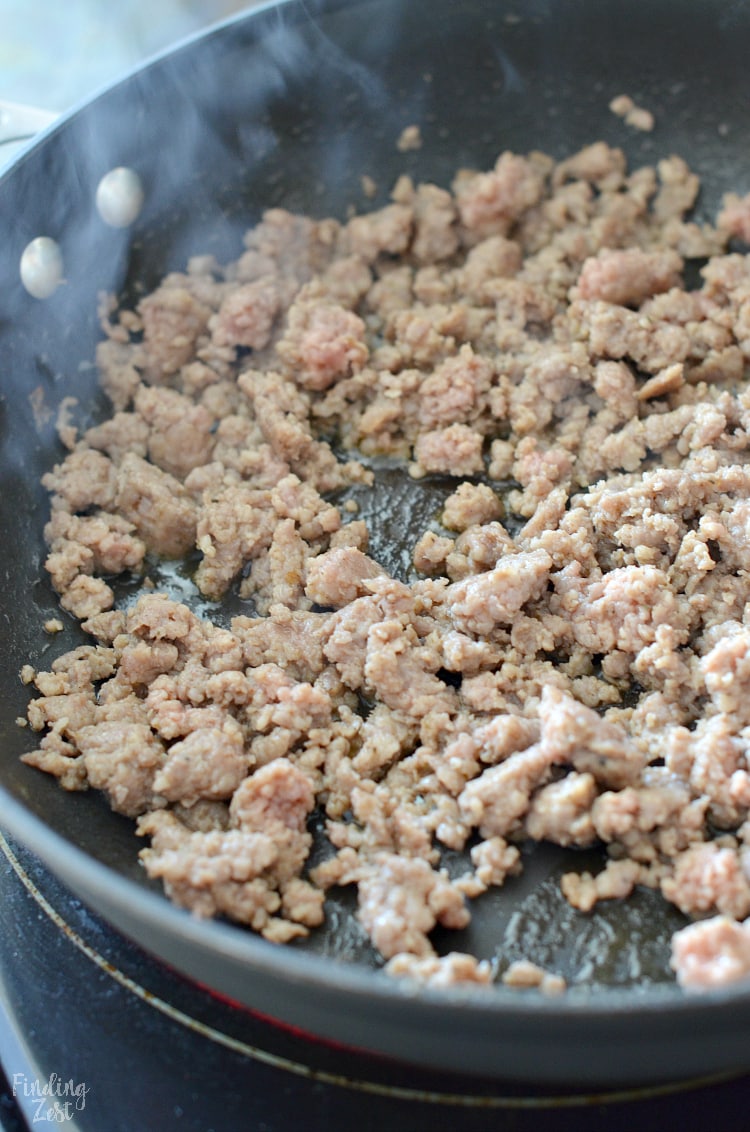 Browning pork sausage on stove for a breakfast casserole