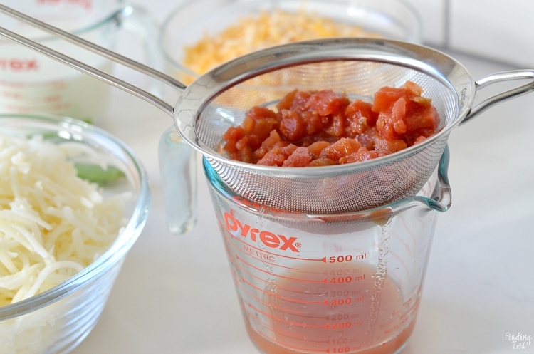 Draining can of Rotel for breakfast casserole