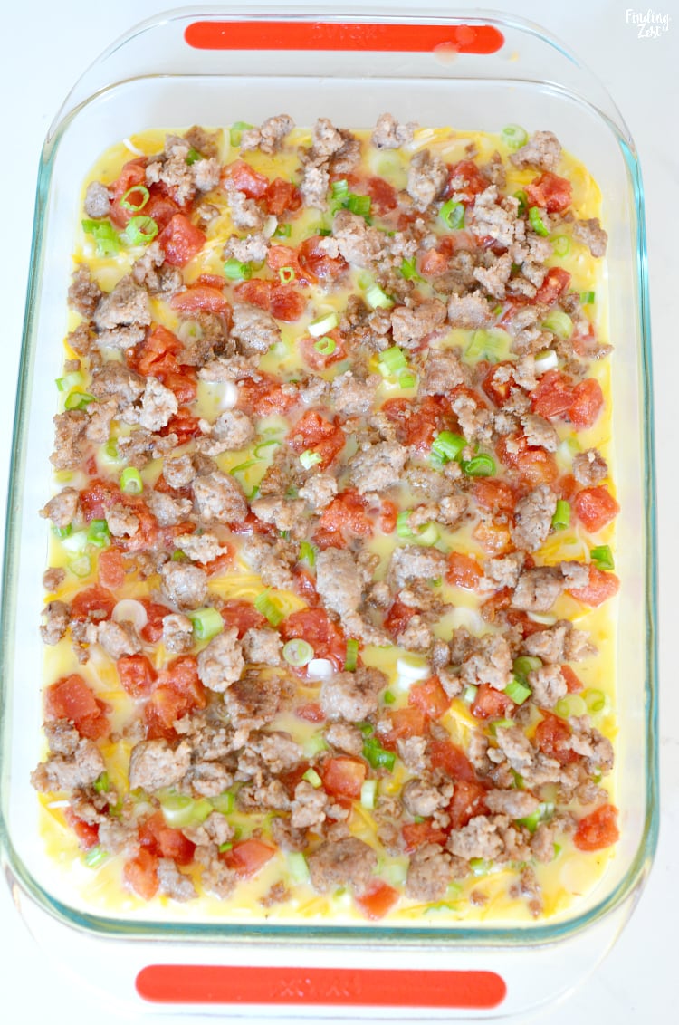 Sausage egg casserole in 13 x 9 inch dish ready to bake