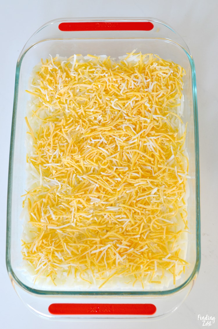 Shredded cheese on hash brown casserole