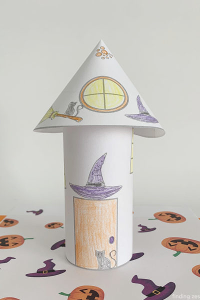 Witch coloring pages come to life with this 3-D haunted house! This free printable is a fun Halloween paper craft that kids can color then cut to turn into their own Halloween decor! Poke holes in the top and add a LED candle to turn this into a luminary!