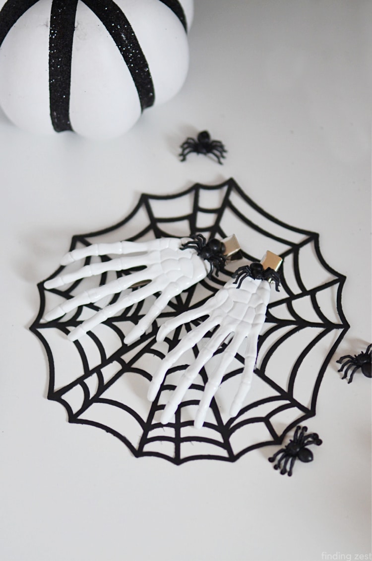 Halloween hair accessories never look cooler than these simple skeleton hands hair clip! Make this fun Halloween craft using items from Dollar Tree!