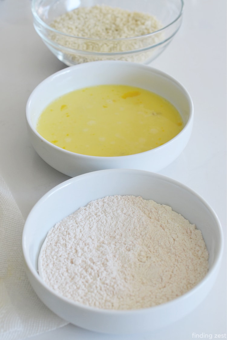 Shallow bowls with flour, egg and panko for dipping
