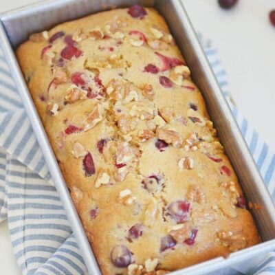 Cranberry Walnut Bread is a tasty combination of flavors you won't be able to resist! Serve guests during the holidays a hearty and flavorful bread that will have them coming back for seconds. This bread is easy to whip up in no time!