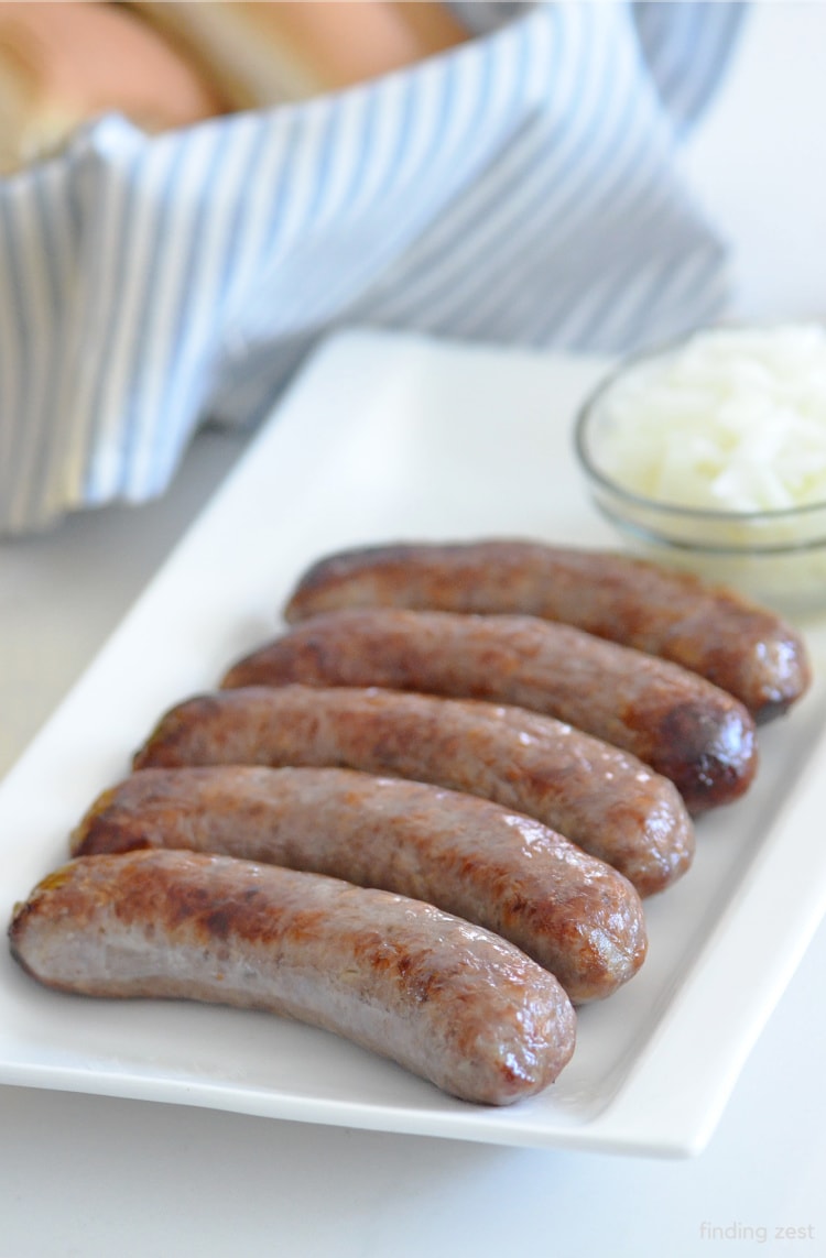 Brats Cooked in an air fryer and ready to be topped with your favorite toppings!
