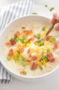Loaded Potato Soup Recipe featuring lots of potatoes, cream cheese and topped with bacon, shredded cheese and green onion!
