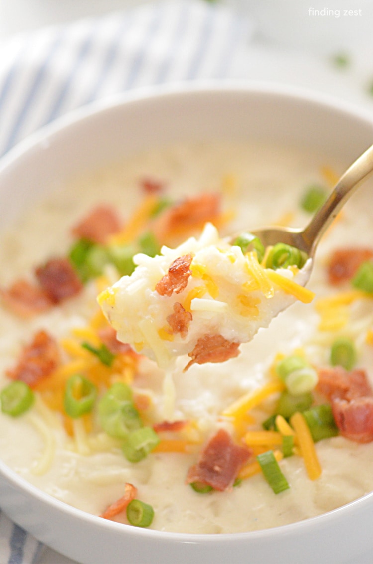 Cream Cheese Potato Soup is an easy dinner that tastes like you spent all day in the kitchen, but it's ready in just 30 minutes! Loaded with potatoes, this creamy soup tastes extra good topped with crumbled bacon, shredded cheese and green onion. 