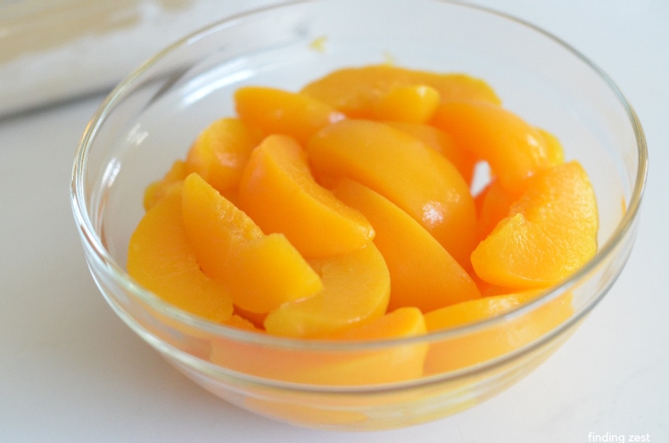 Very well drained canned peaches in a bowl