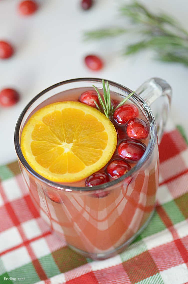 Cranberry Cider is so easy and delicious! This is the perfect Christmas cider and simple to serve at just the right temperature, making it ideal for serving guests. Bonus, it will also make your house smell divine!