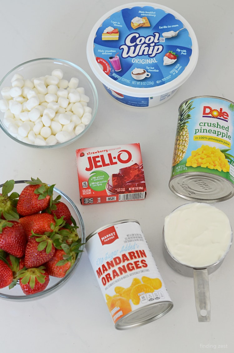 Fresh strawberries Jello crushed pineapple mandarin oranges mini marshmallows cool whip and sour cream for fluff salad