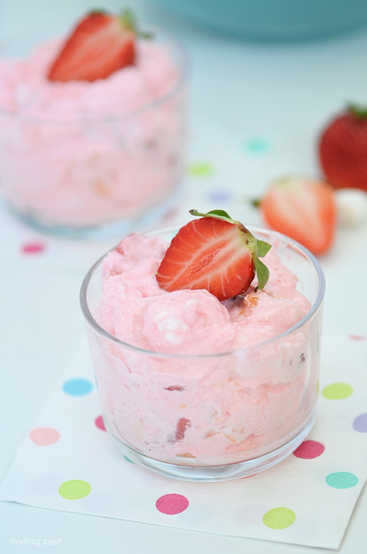 Strawberry Fluff Jello Salad is refreshing fruit salad with fresh strawberries, cool whip, jello, crushed pineapple and mandarin oranges! This recipe does not have cottage cheese. Makes a great holiday side dish.