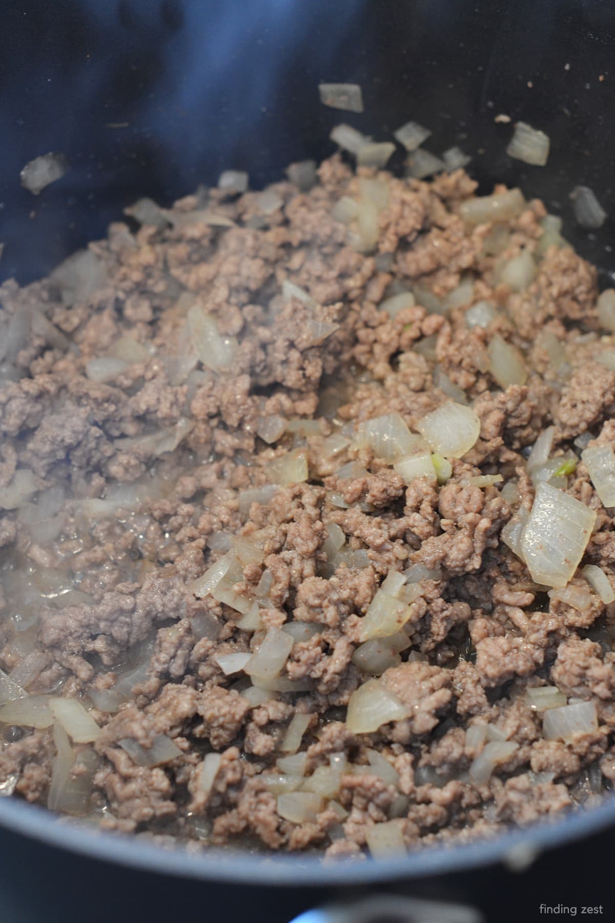 Browning hamburger and onion in a pot