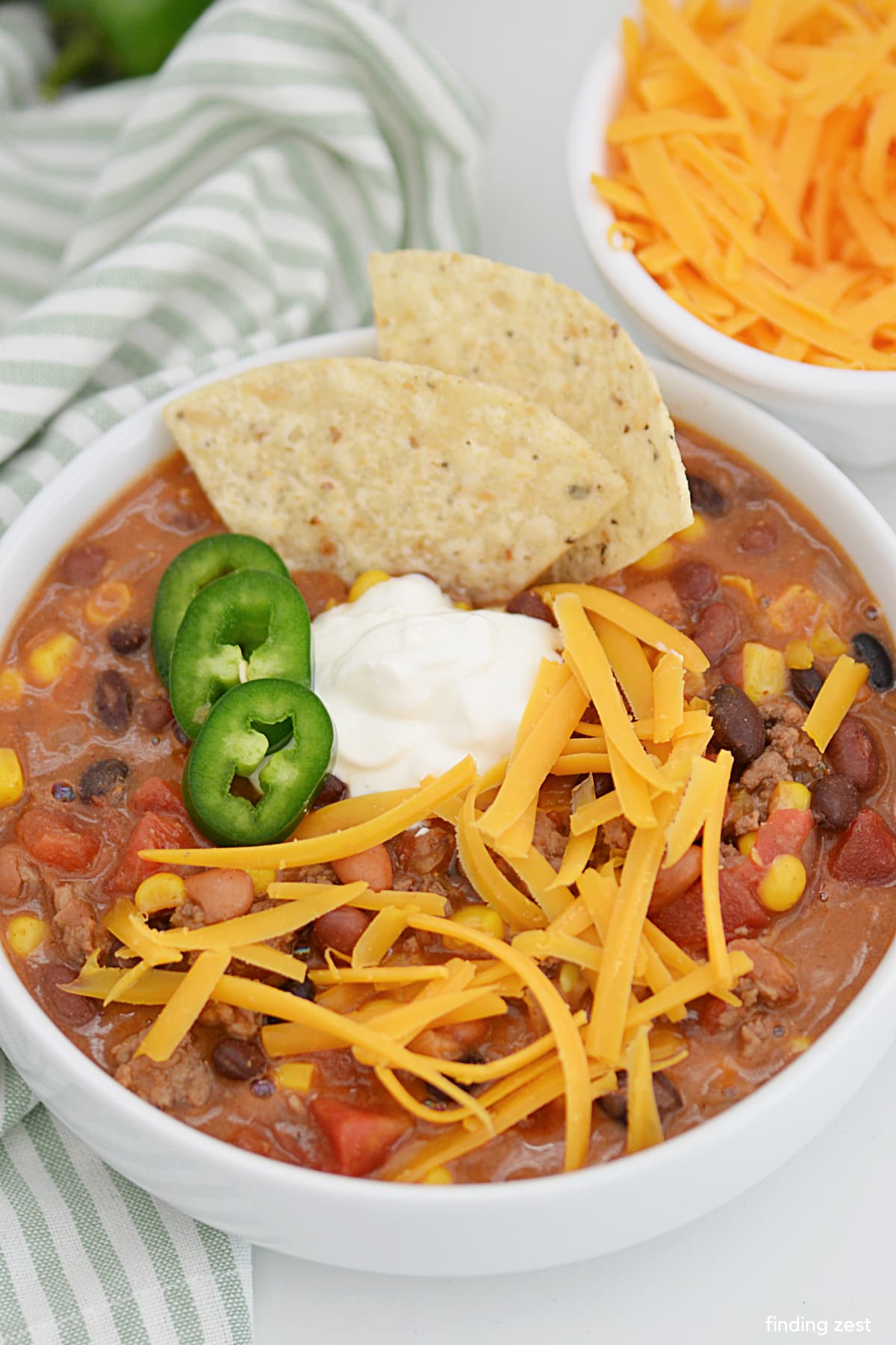 Comfort food at its finest, this taco soup is sure to become a family favorite! This one-pot meal requires little effort, minimal clean up but is ridiculously good. All you need are ground beef, seven canned goods, two seasoning packets and an onion.