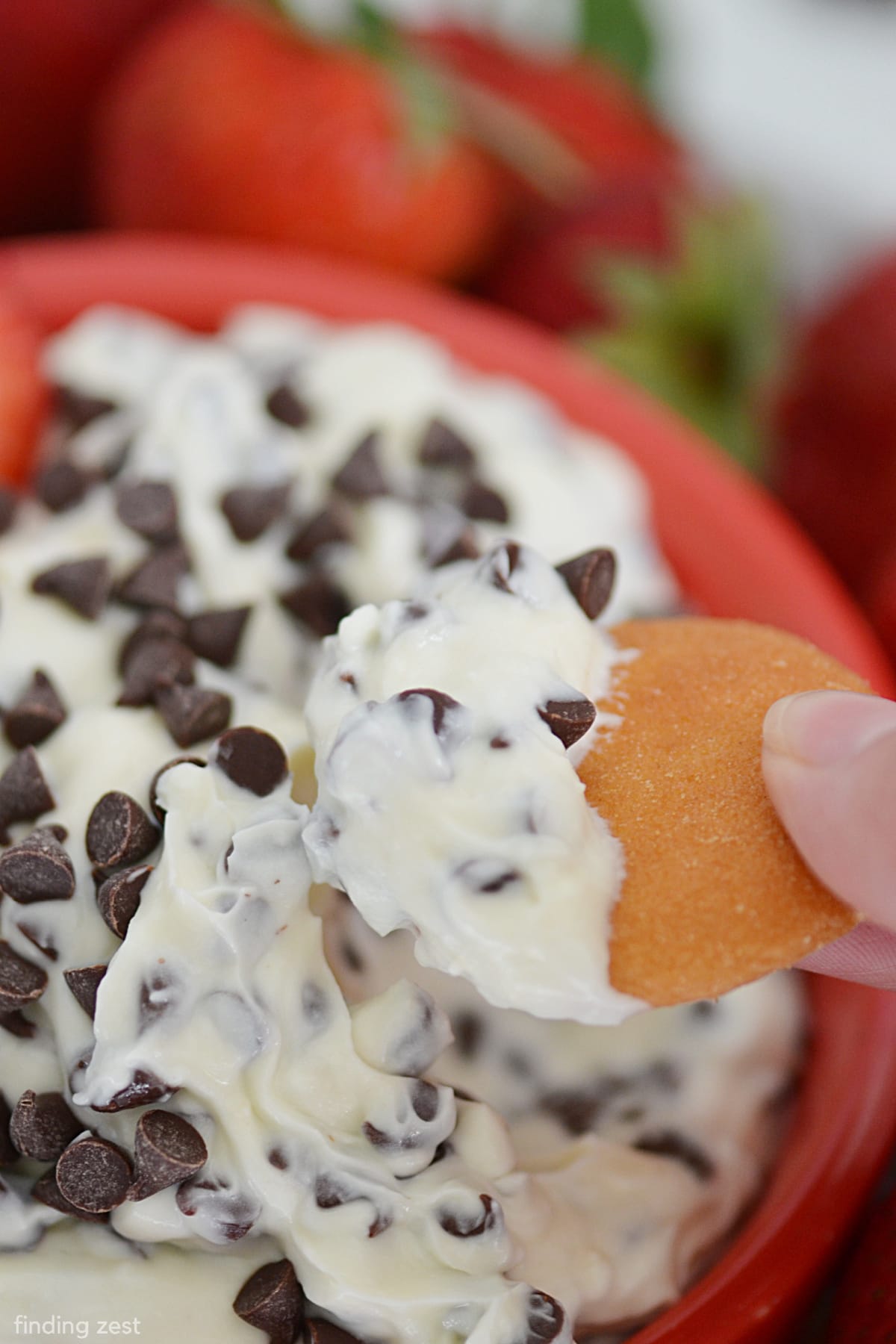 If you love cheesecake you'll love this cream cheese chocolate chip dip! Serve this dessert dip at your next potluck or holiday celebration and be the hit of the party! Works great for any time of year from 4th of July to Christmas or Easter! The combination of cream cheese and mini chocolate chips make it irresistible. Serve with strawberries, graham crackers or pretzels!
