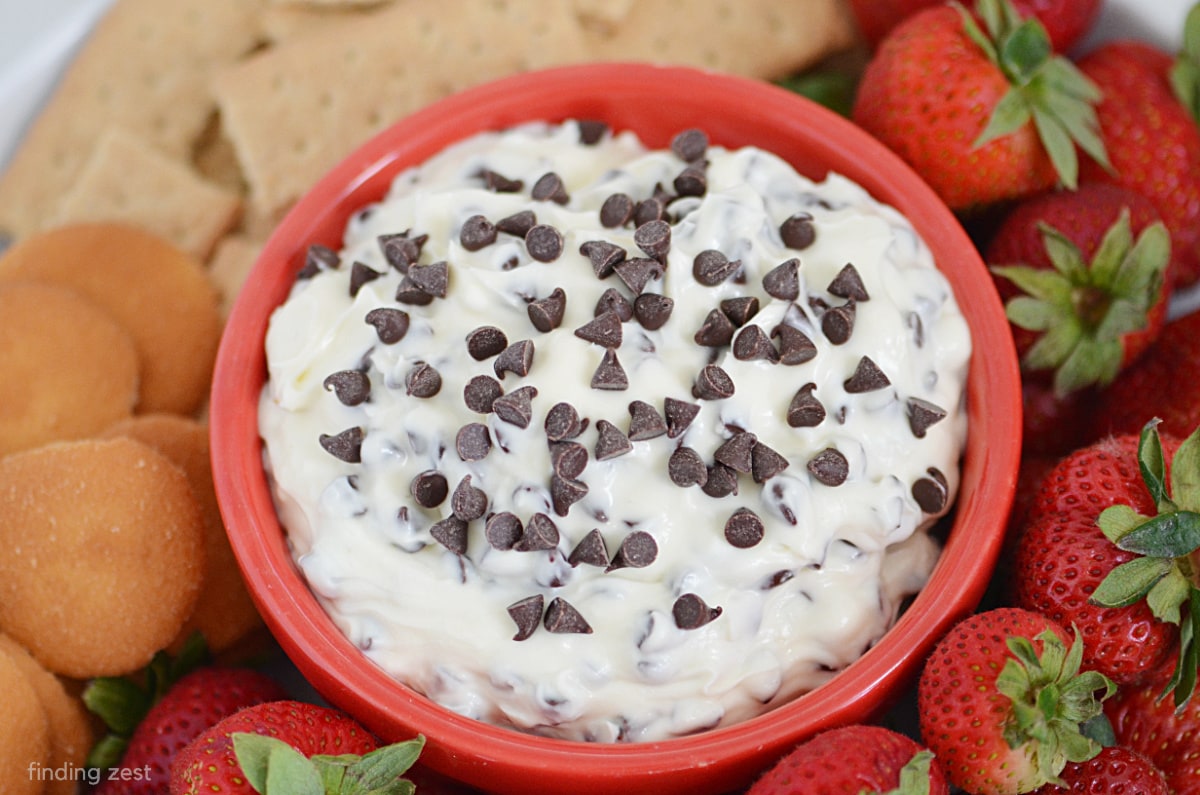 Looking for a delicious dessert dip recipe that will wow your guests at your next party? Look no further than this chocolate chip dip made with cream cheese! This sweet and creamy dip is perfect for dipping strawberries, graham crackers, pretzels or vanilla wafers!