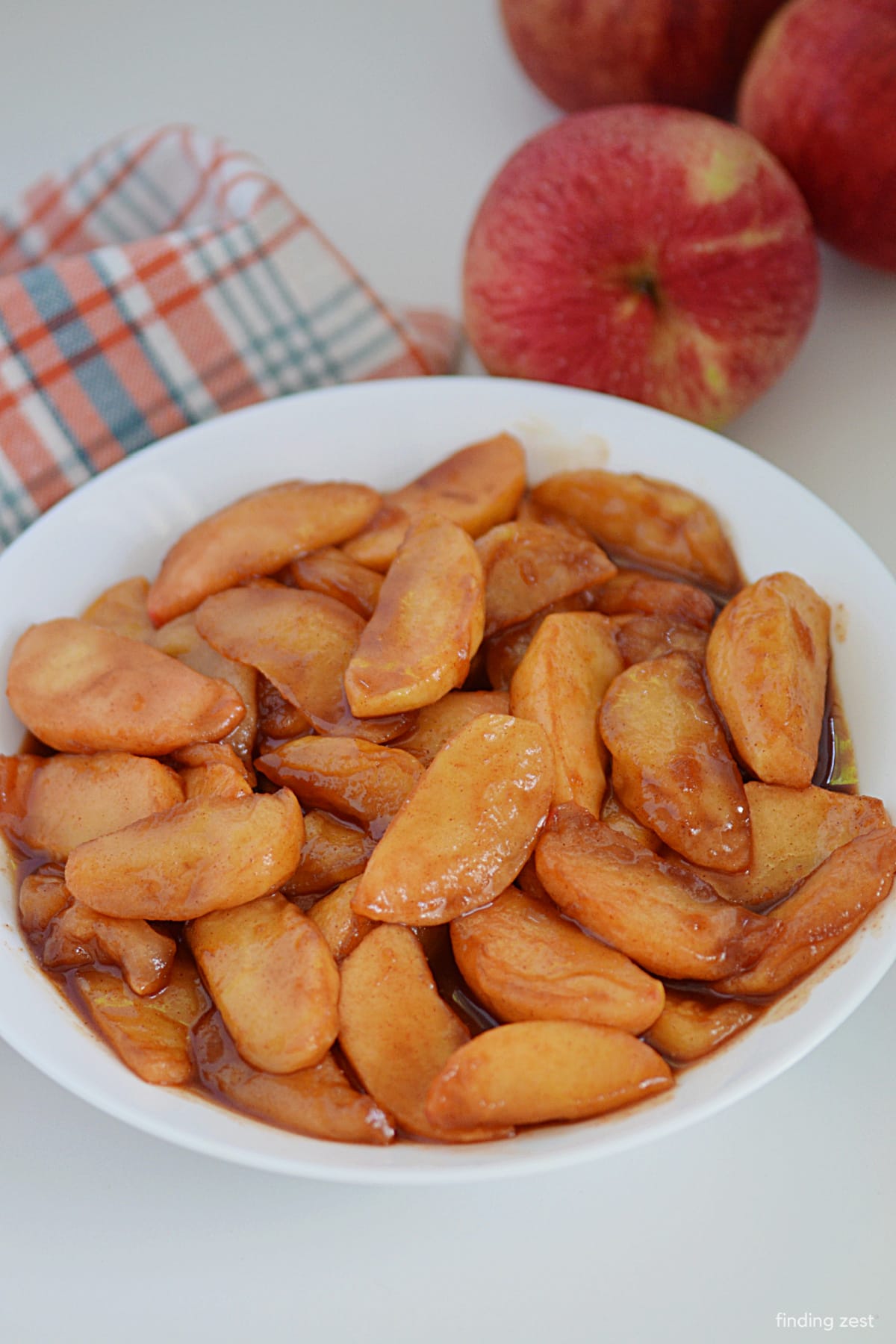 Need an easy fried apple recipe? Look no further! Brown sugar, cinnamon, and butter turns simple apple slices into a special treat or side dish. Everyone will love these cinnamon apples!