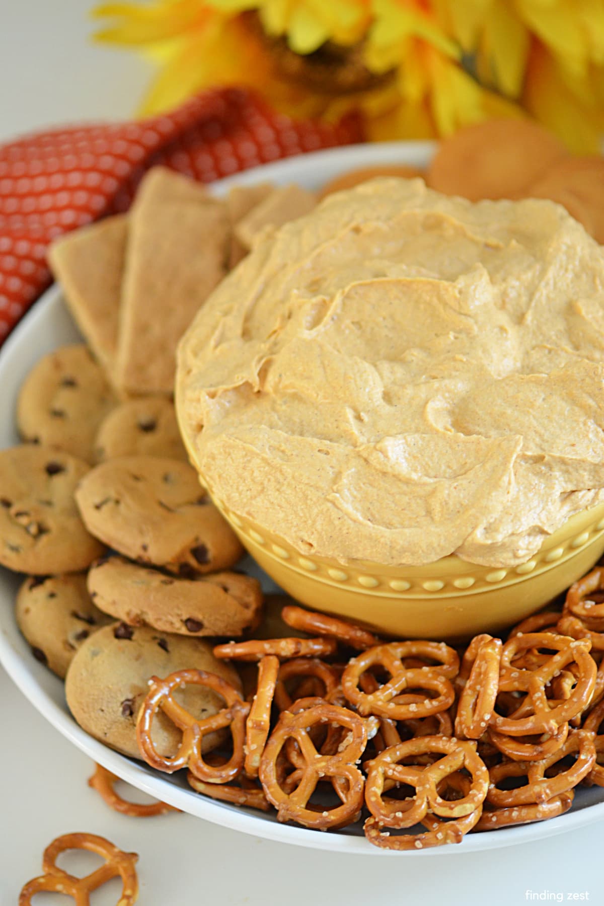 Pumpkin fluff requires just 5 ingredients and takes 5 minutes to make. This is the easiest no-bake appetizer or snack for any fall or holiday gathering. Serve this dessert dip with your favorite dippers such as vanilla wafers, pretzels or apple slices.