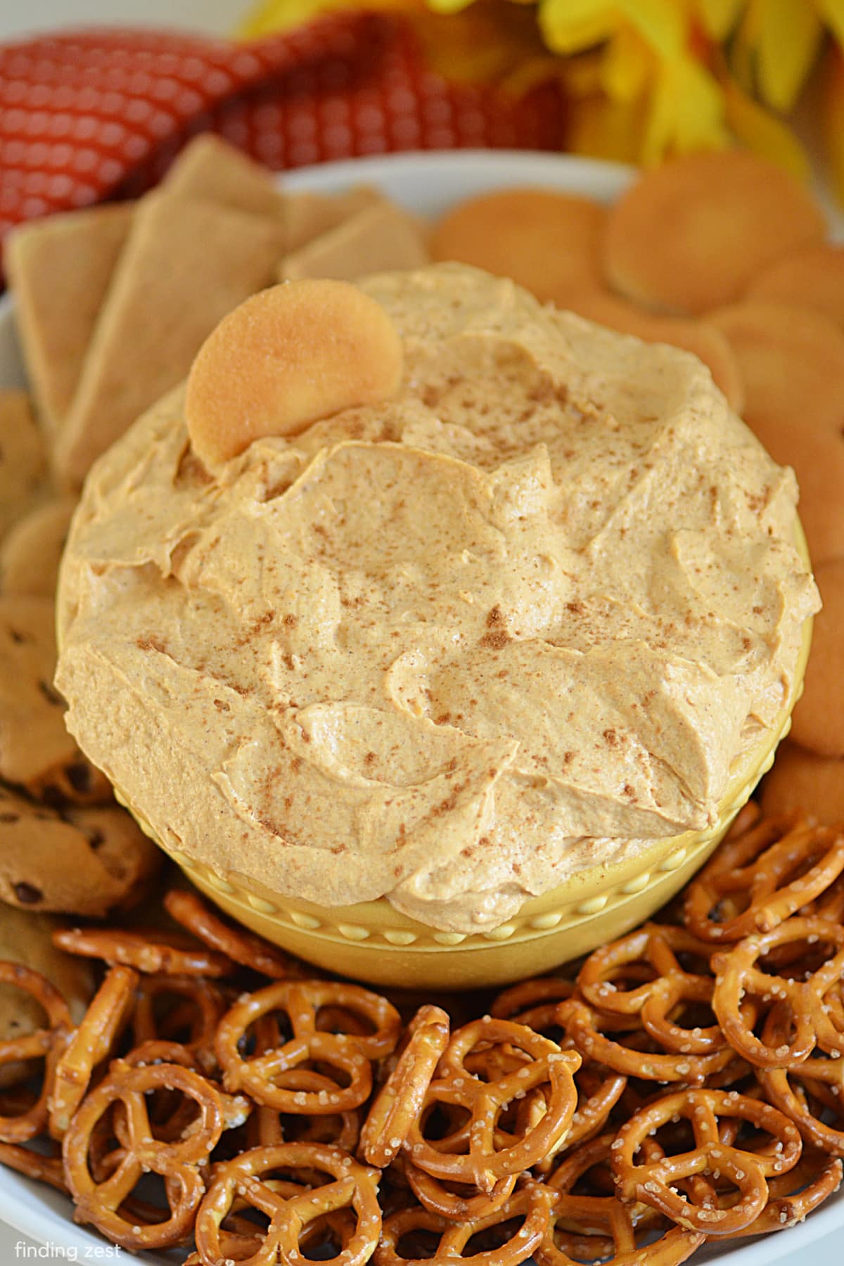 This pumpkin fluff dessert dip is easy to make and a great no bake snack. It's perfect for parties or any time you need a quick appetizer or dessert. Best of all, there's no cream cheese needed! Just mix together some pumpkin puree, whipped topping, and sweetened condensed milk and you're done.