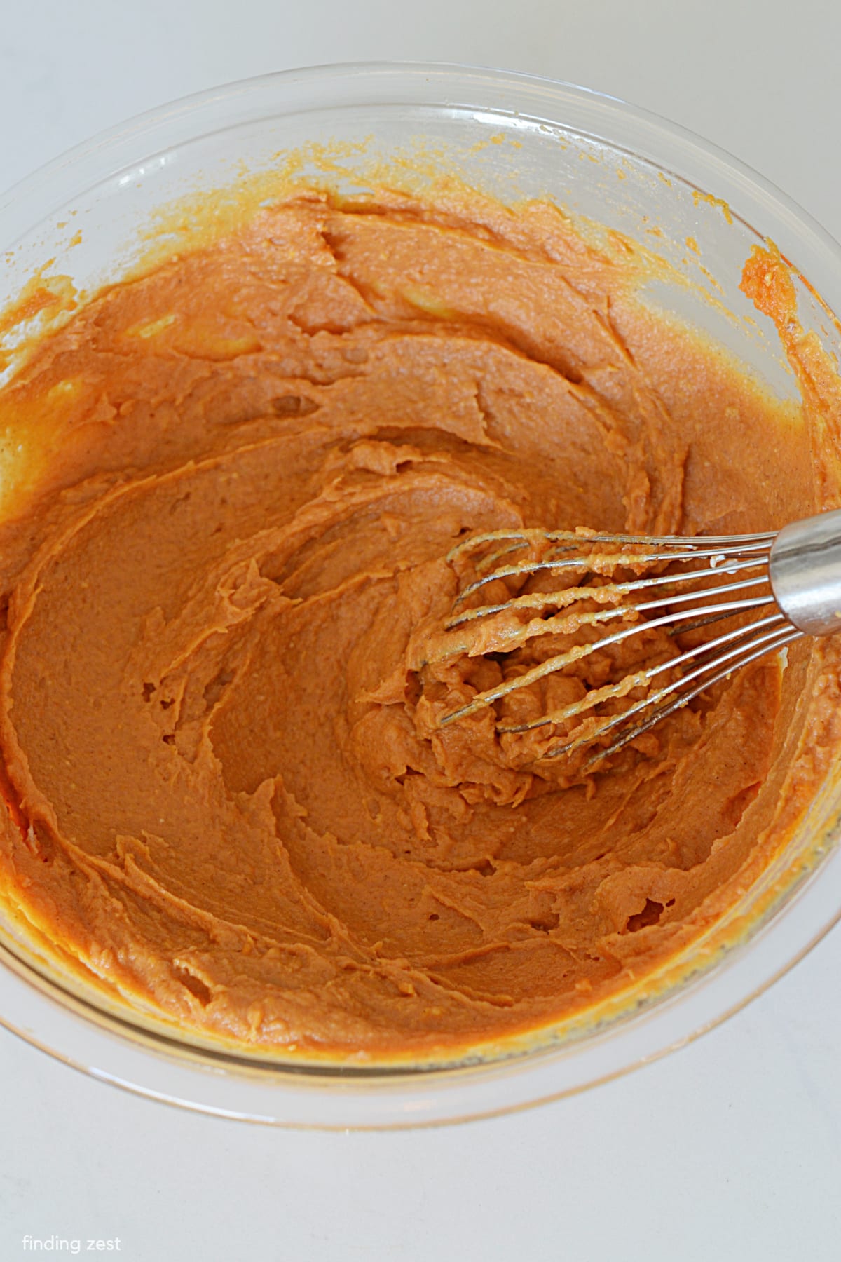 Whisking canned pumpkin, pudding and spices