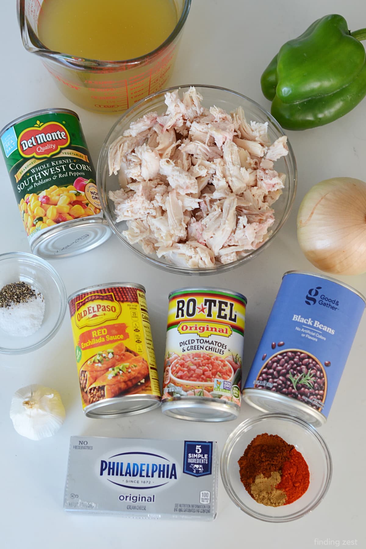 Ingredients for enchilada soup including leftover rotisserie chicken, enchilada sauce, corn and black beans