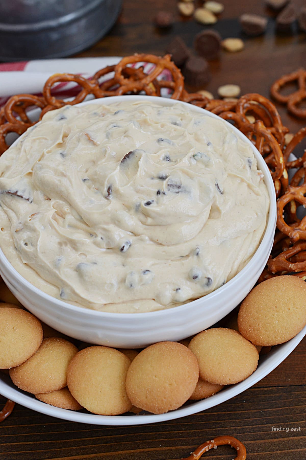 Peanut Butter Dessert Dip with cream cheese, whipped topping, peanut butter cups, salted peanuts and mini chocolate chips!