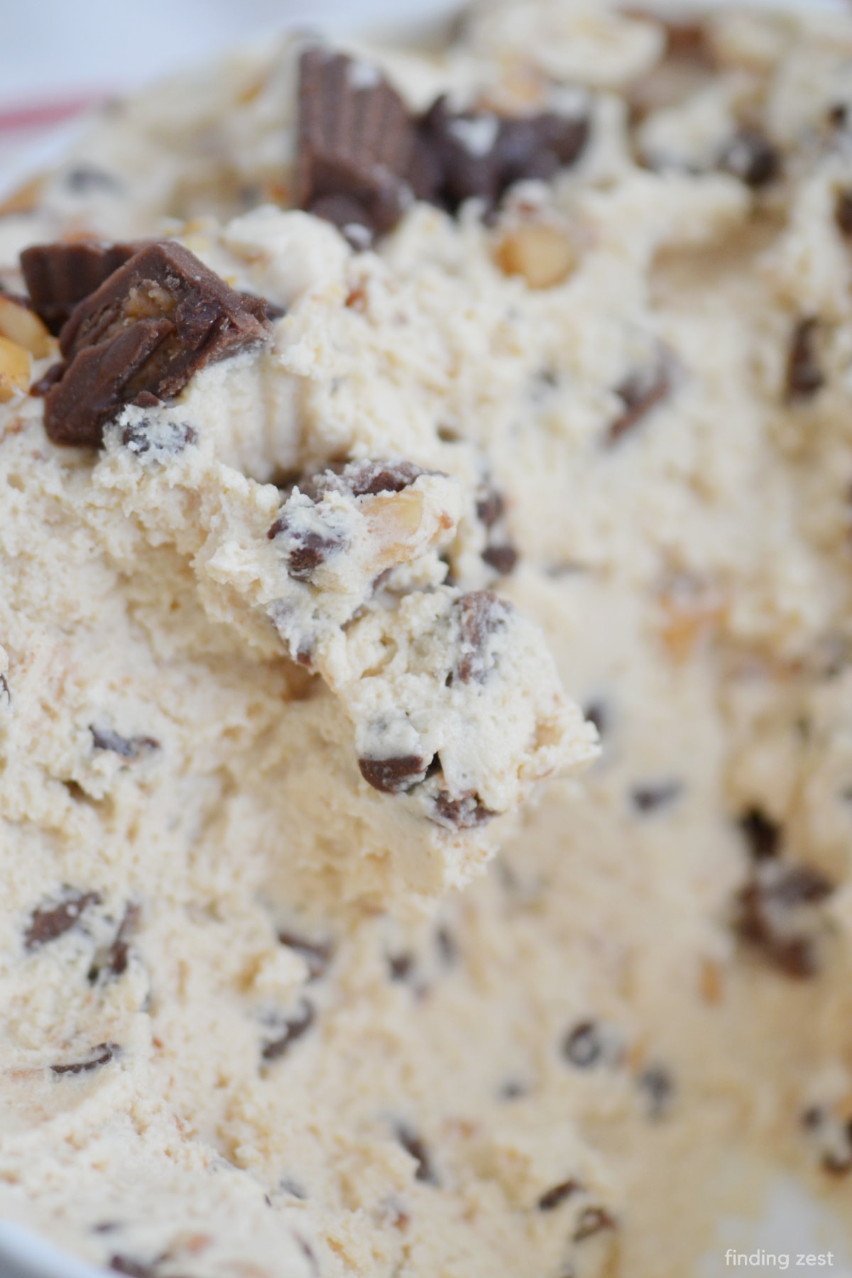 Peanut butter fluff dip is the best dessert dip recipe! Loaded with peanut butter cups, peanuts, and mini chocolate chips, this cream cheese dip is always a favorite appetizer or no bake dessert recipe.