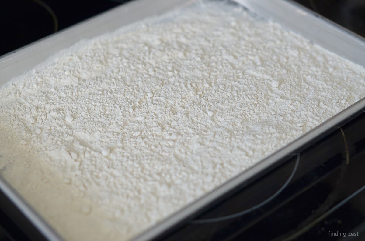 Flour on a baking sheet to heat treat flour