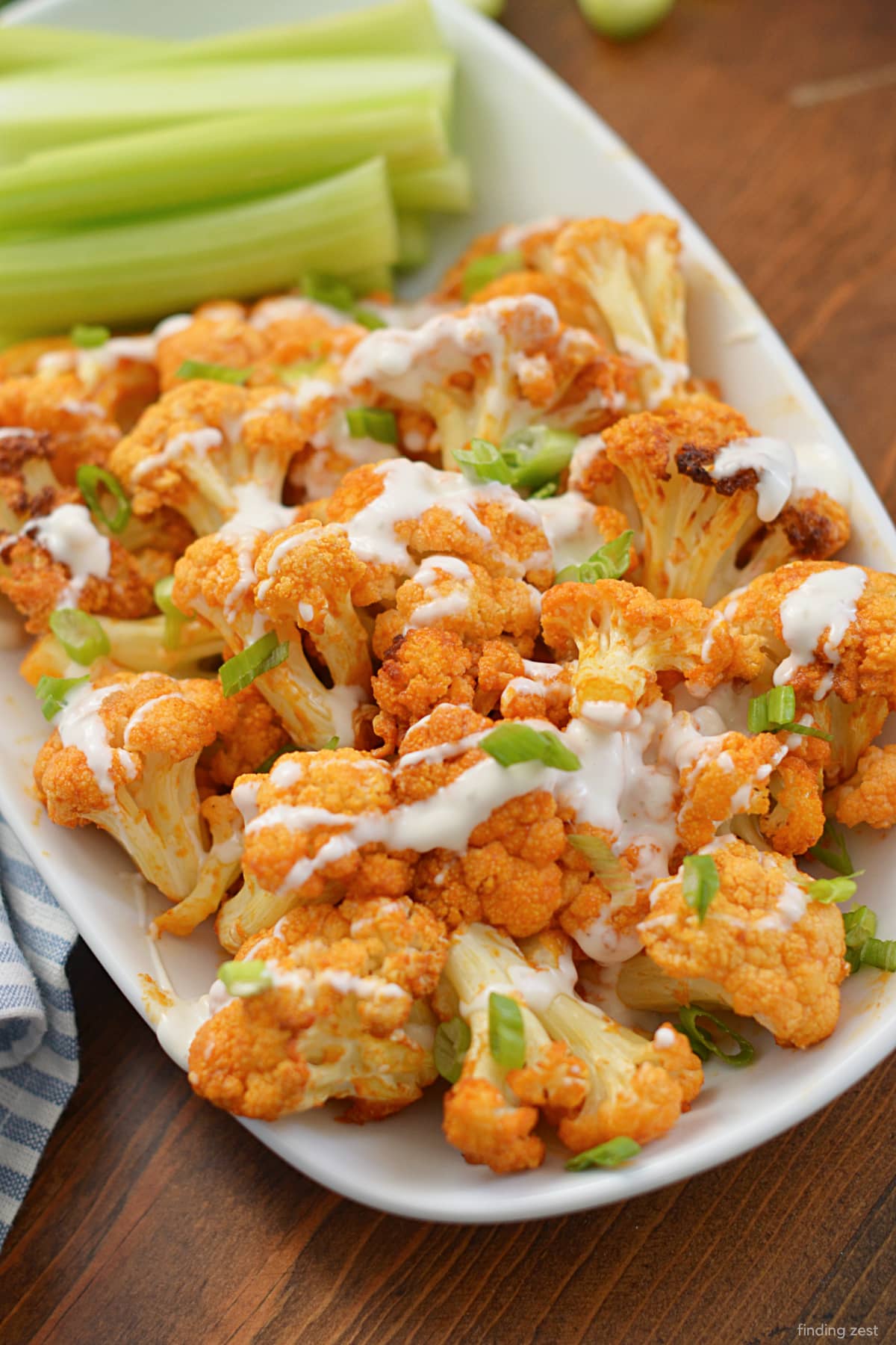 Air Fried Buffalo Cauliflower is the ultimate appetizer or side dish for those who love spicy foods! This simple recipe requires just four ingredients and is a great option for anyone on a keto or low carb diet! 
