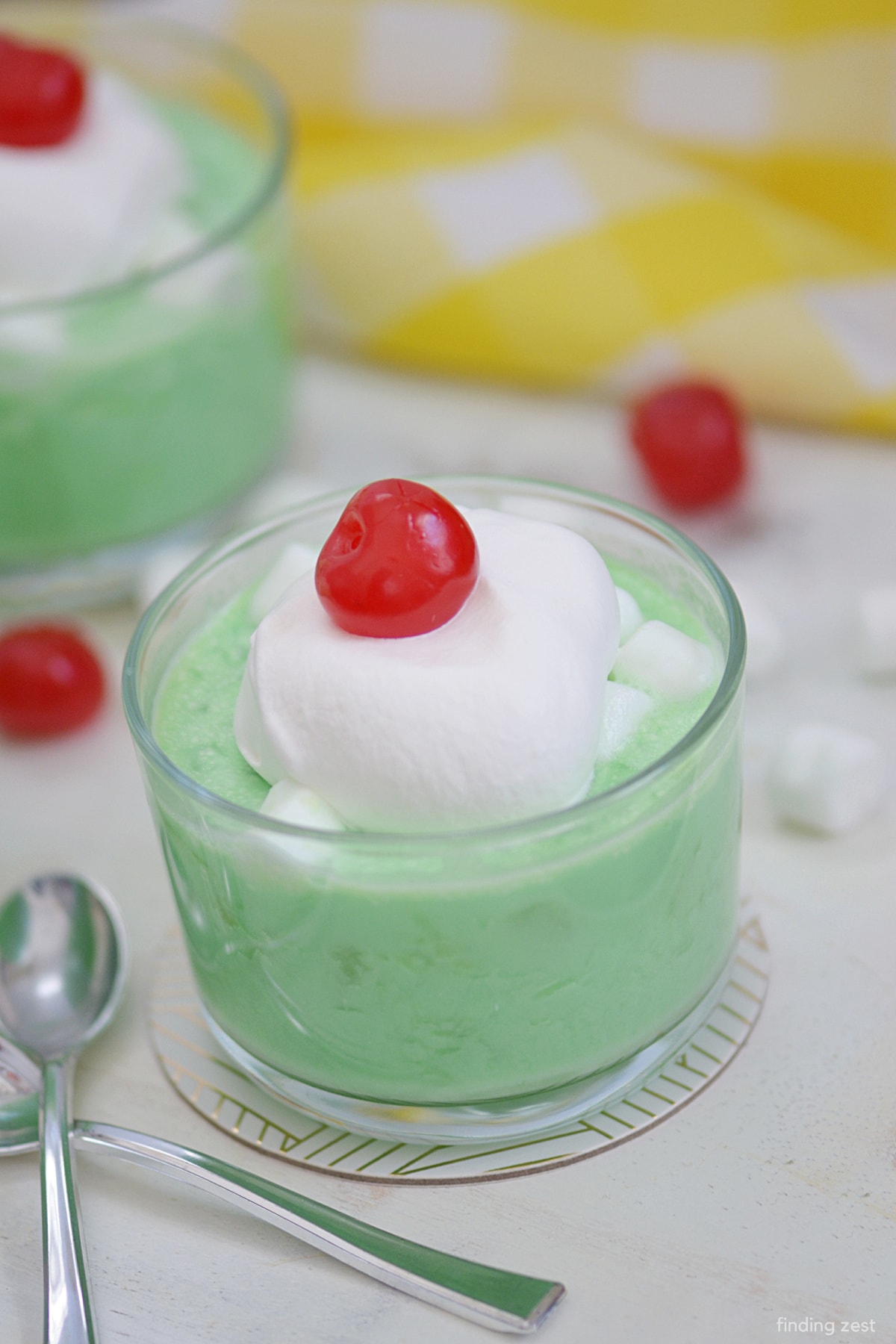 Lime jello salad doesn't get any easier than this recipe! All you need is a few minutes to whip together this lime jello with cream cheese, crushed pineapple and marshmallows. Everyone will love this refreshing side dish or dessert. Works great for any holiday, especially Christmas or Easter dinner!