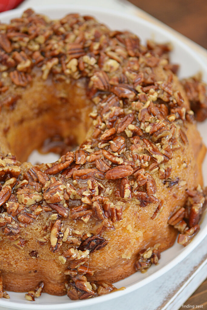 This pecan upside down cake is a crowd-pleasing dessert that is bound to be a hit with everyone!  A sweet, sticky, and tempting pecan topping completes this recipe for a moist and flavorful cake.