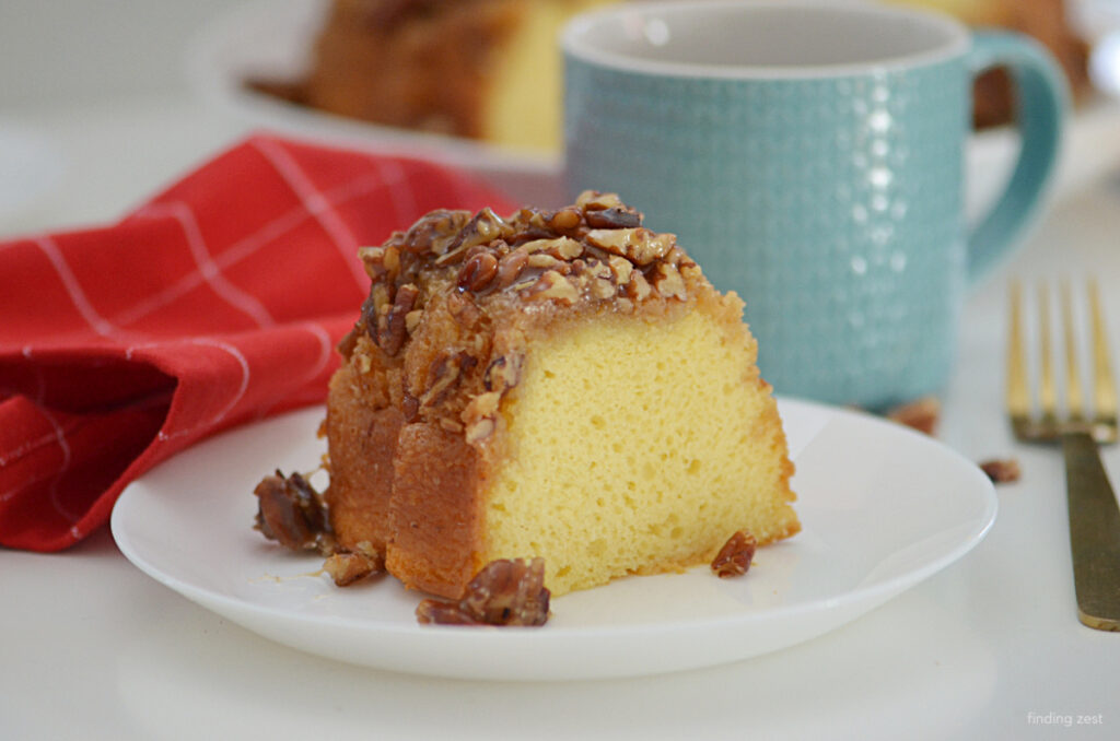 This recipe for pecan upside down cake is the best! Featuring a yellow cake mix, sour cream and milk for the most moist and tender cake. Also featuring an irresistible pecan topping!