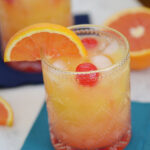 Start your day off with this vibrant Tequila Sunrise Mocktail! This refreshing non-alcoholic beverage is made with orange juice, pineapple juice, grenadine syrup, and maraschino cherries for a sweet and fruity flavor. With its bright colors and sunny taste, this mocktail is the perfect way to add some sunshine to your day!