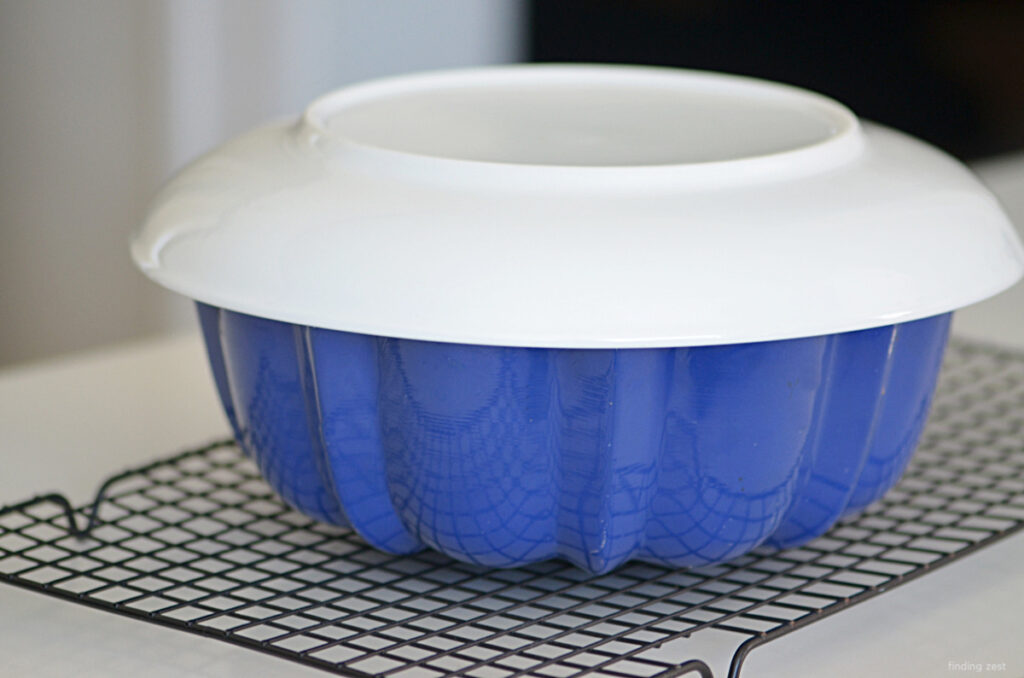 Getting ready to flip an upside down cake over using a bundt pan.
