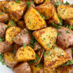 Air Fryer Potatoes are so crispy and delicious! Everyone will go nuts for this simple baby red potatoes loaded with flavor using basic pantry spices! Serve these amazing potatoes at your next holiday dinner for for a simple weeknight side dish!