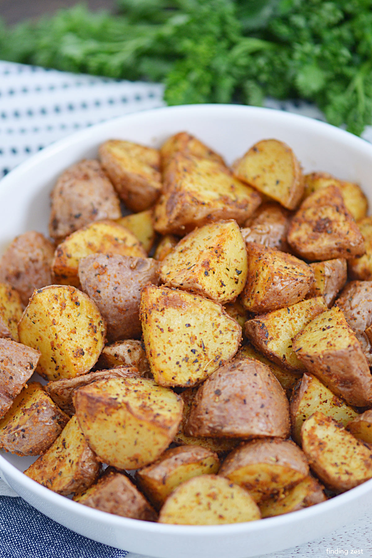 Air Fryer Red Potatoes are so easy! You'll love how simple it is to prepare these roasted potatoes in the air fryer for a quick side dish! Skip the oven and serve these crispy potatoes with your favorite weeknight meal or add it to your holiday dinner menu!