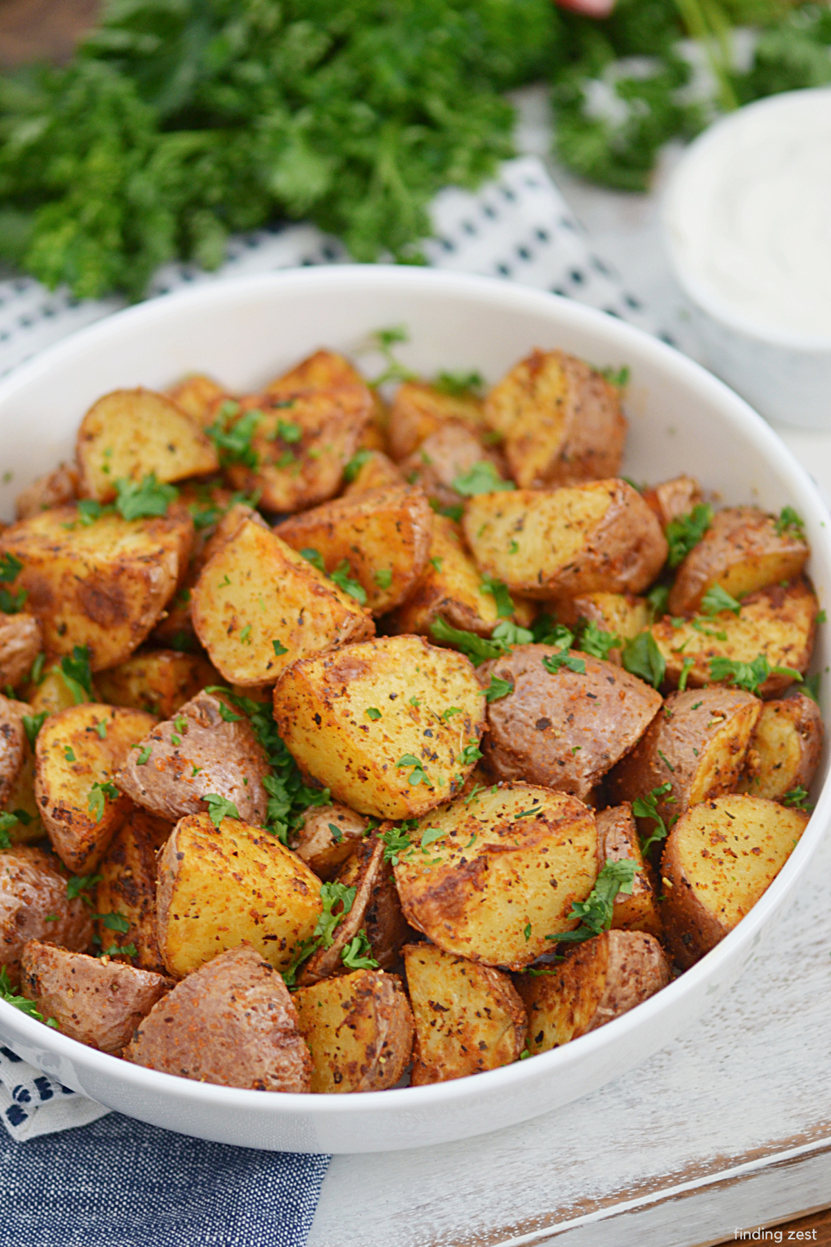 Air Fryer Red Potatoes are a simple side dish and sure to be a hit! Simple pantry spices are all you need to season these crispy potatoes that can be prepared in a fraction of the time it takes to roast them in the the oven. Try them for your next holiday dinner or weeknight meal!