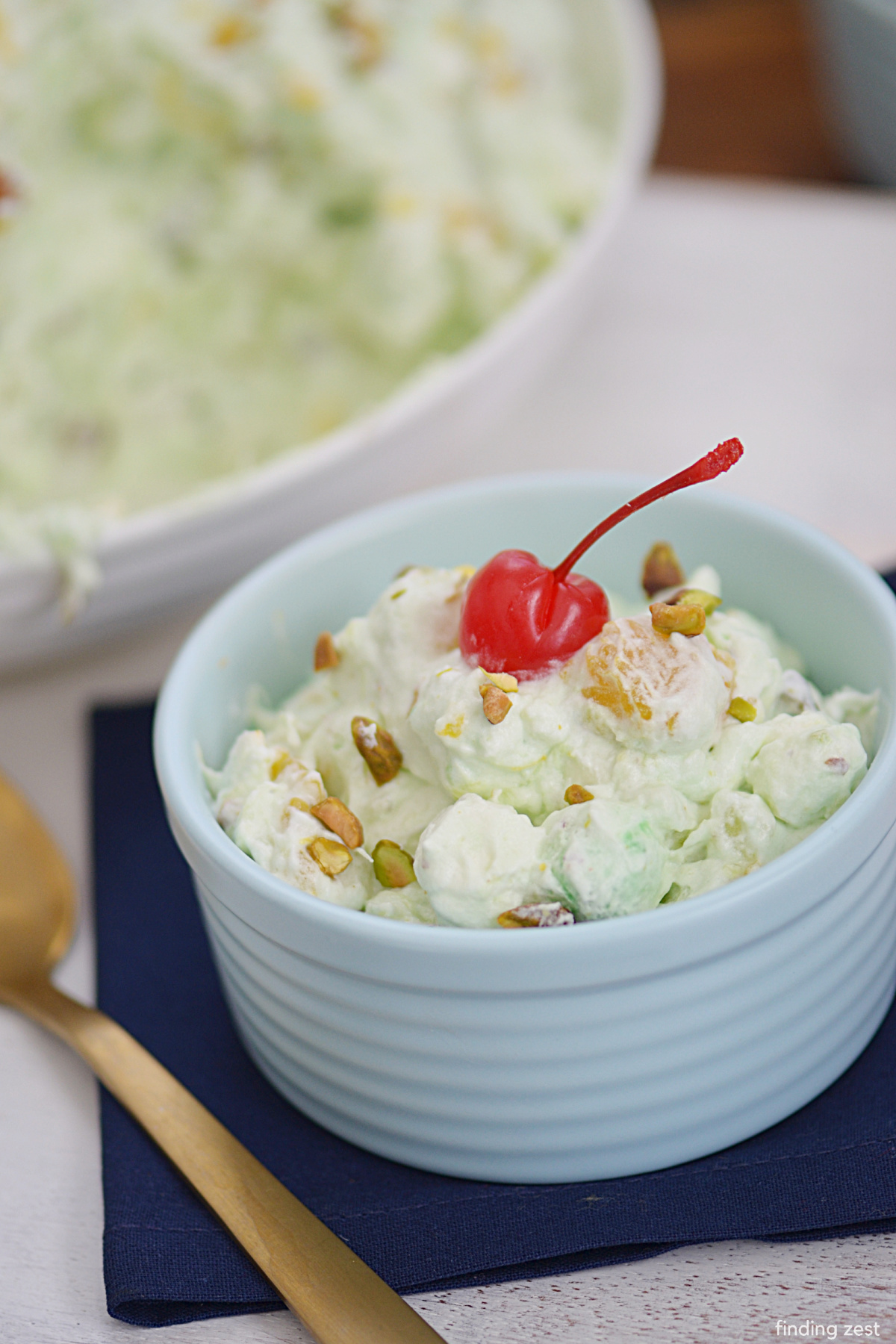 Green fluff recipe that is so easy to put together! Everyone will love this fluffy fruit salad with pistachio pudding!