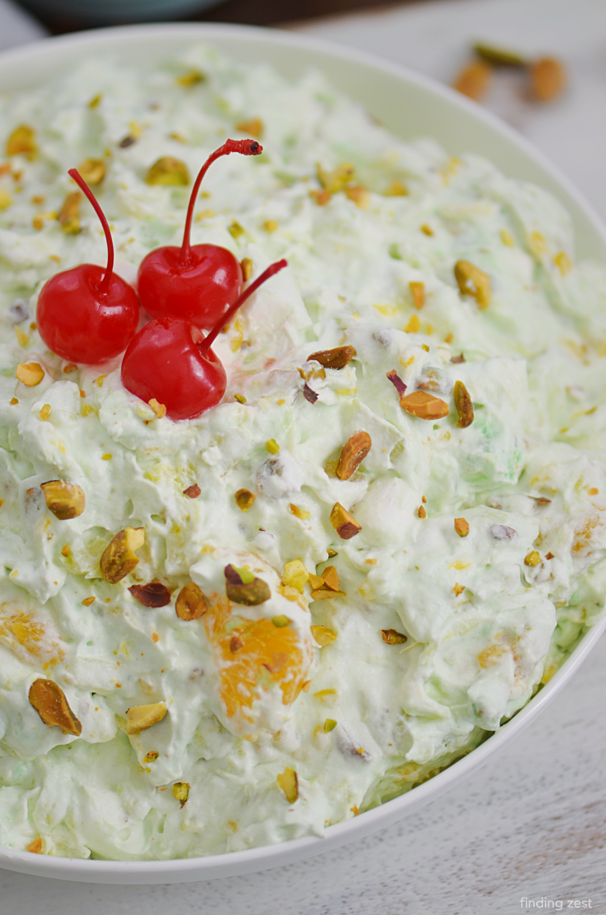 Need an easy side dish or dessert? This Pistachio Fluff Recipe can be made in no time! Everyone will love this fluffy fruit salad. It is so creamy and delicious!