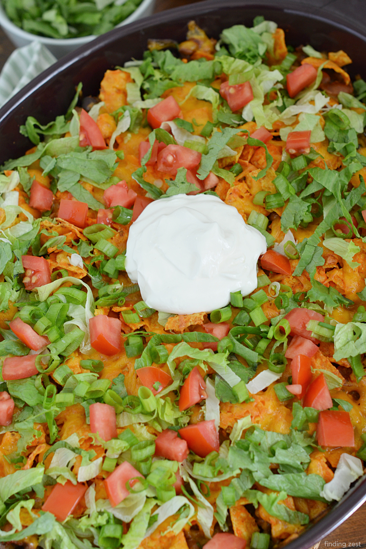 Calling all taco lovers! This taco casserole is a great change of pace from the usual taco night. Layered seasoned ground beef with Doritos and shredded cheese, this casserole recipe is sure to be a hit with the whole family. Finish off your walking taco casserole with your favorite taco toppings such as shredded lettuce, diced tomatoes, green onions, and sour cream!