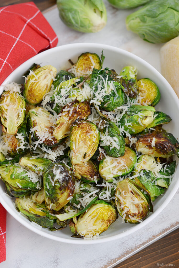 Crispy Roasted Brussels Sprouts cooked to perfection in the air fryer, tossed with savory Parmesan cheese and featuring balsamic vinegar. A simple and flavorful side dish that's sure to be a hit!