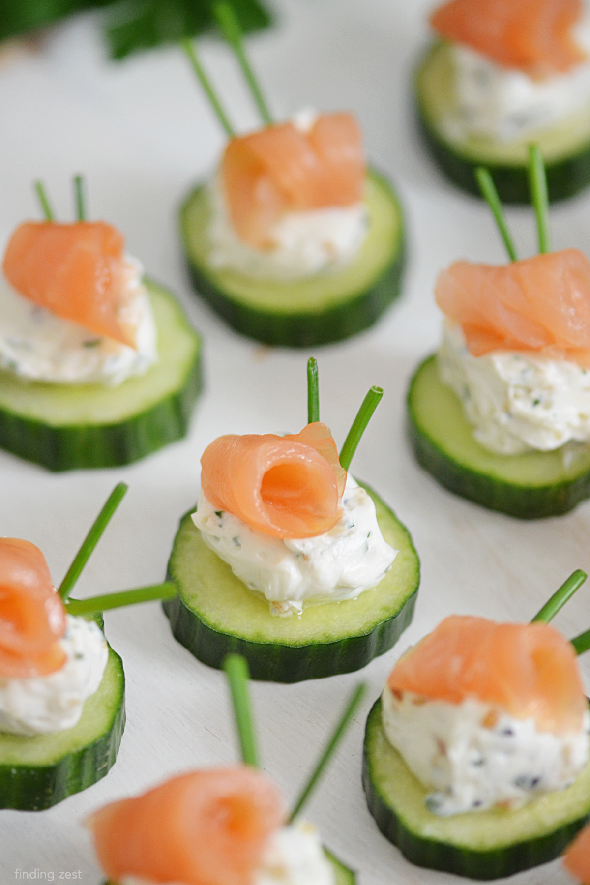 Cucumber Salmon Bites are the ultimate cold appetizer! Naturally low carb and gluten-free, this recipe needs to be added to your list of finger food ideas. Refreshing and simple, this is an elegant addition to your dinner party, wedding shower, Thanksgiving or Christmas appetizer spread!