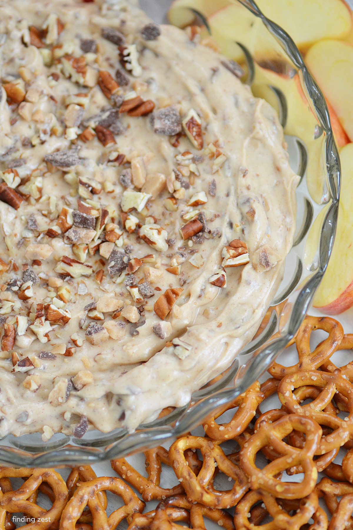 Toffee Apple Dip is a quick and easy fall recipe! Everyone will love this creamy toffee dip featuring cream cheese, brown sugar, pecans and toffee dips. Serve it with your favorite crunchy apples, pretzels, vanilla wafers and more!